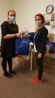 Handing over the masks from the charity competition